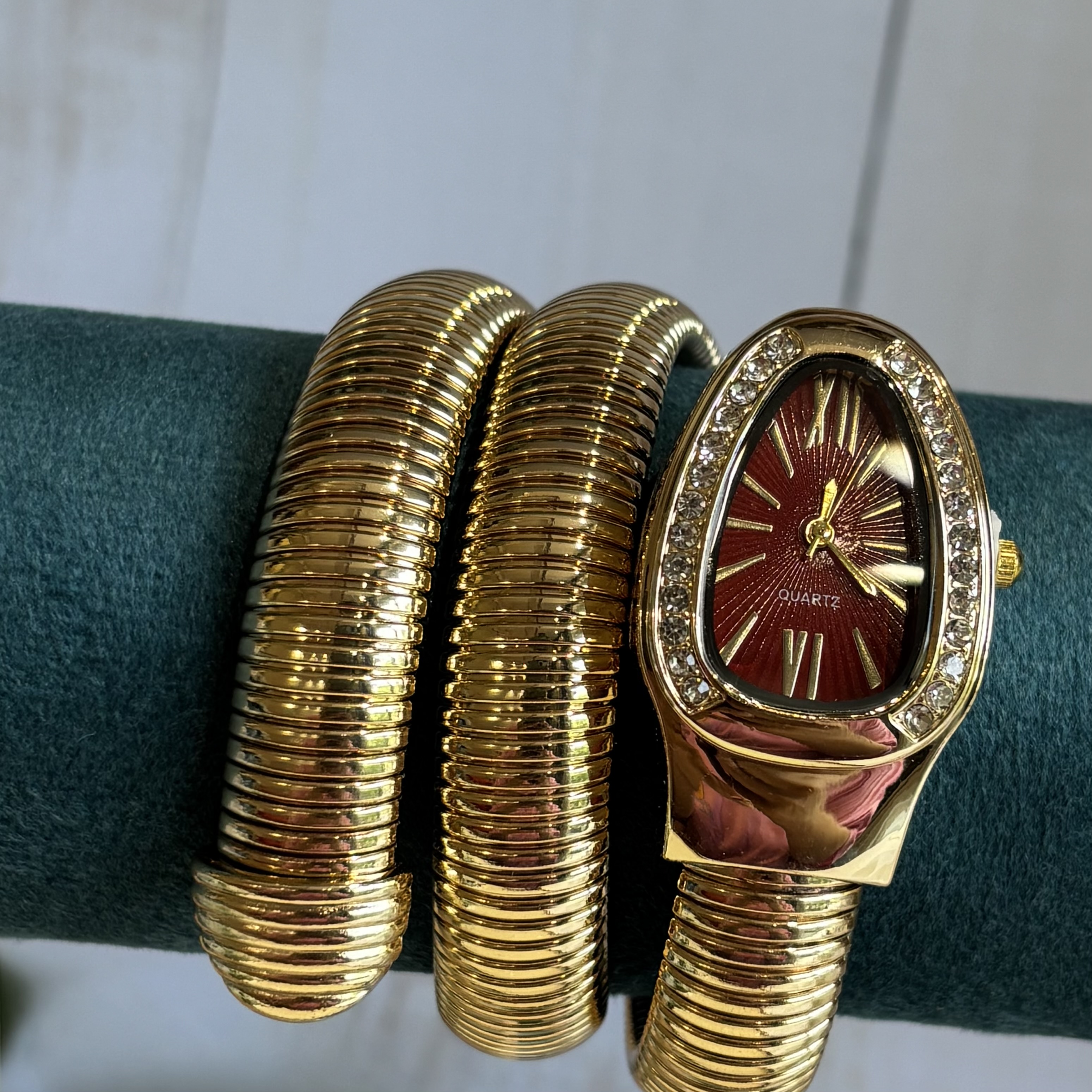 Serpent watch maroon dial- gold