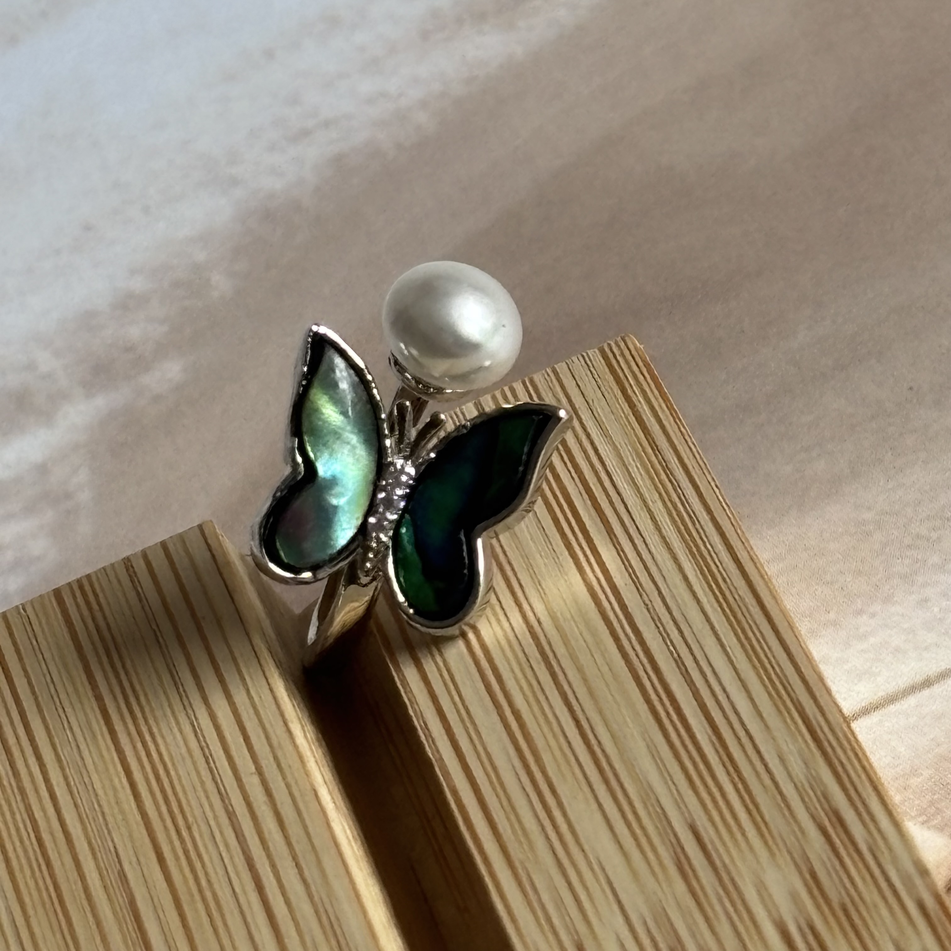Butterfly with pearl ring