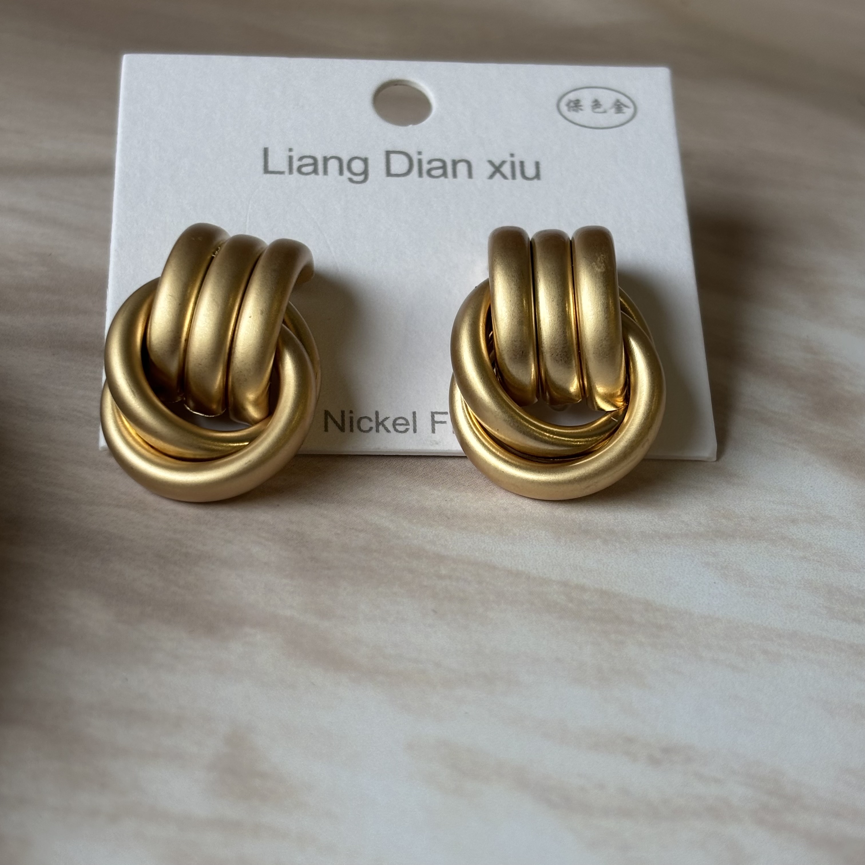 Creamy tangled studs