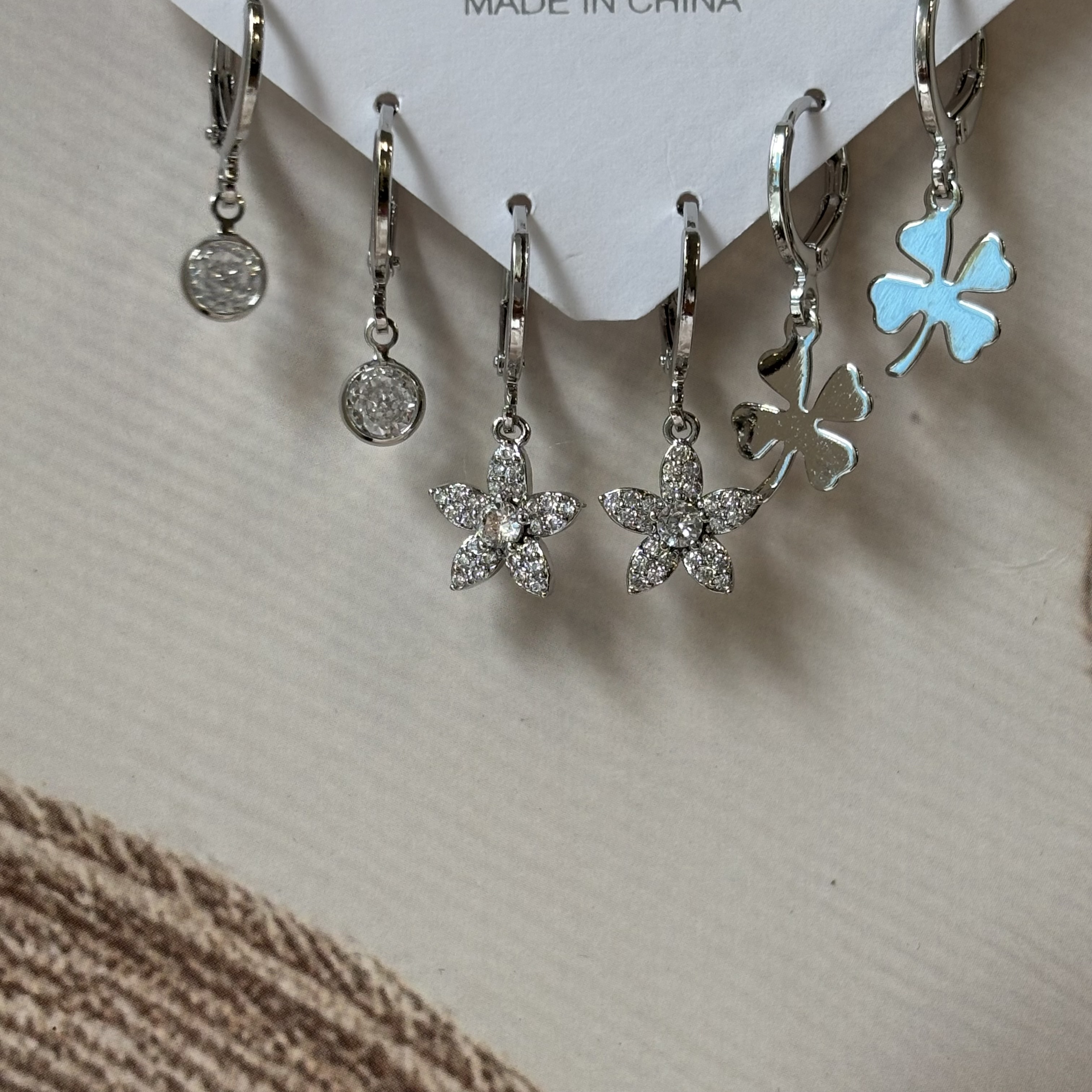 3 pairs of silver earrings- flower