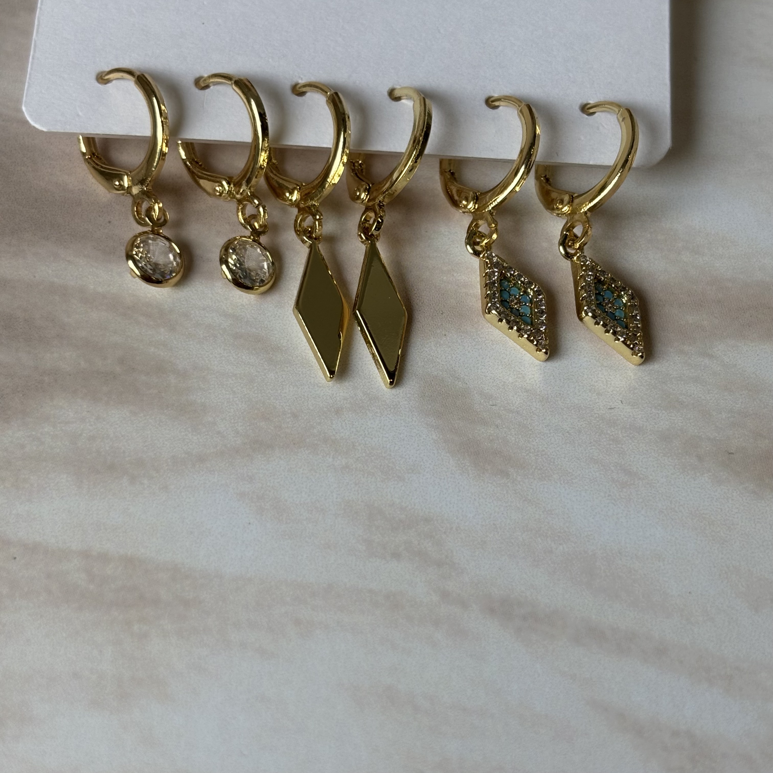 3 pairs of golden earrings- chips
