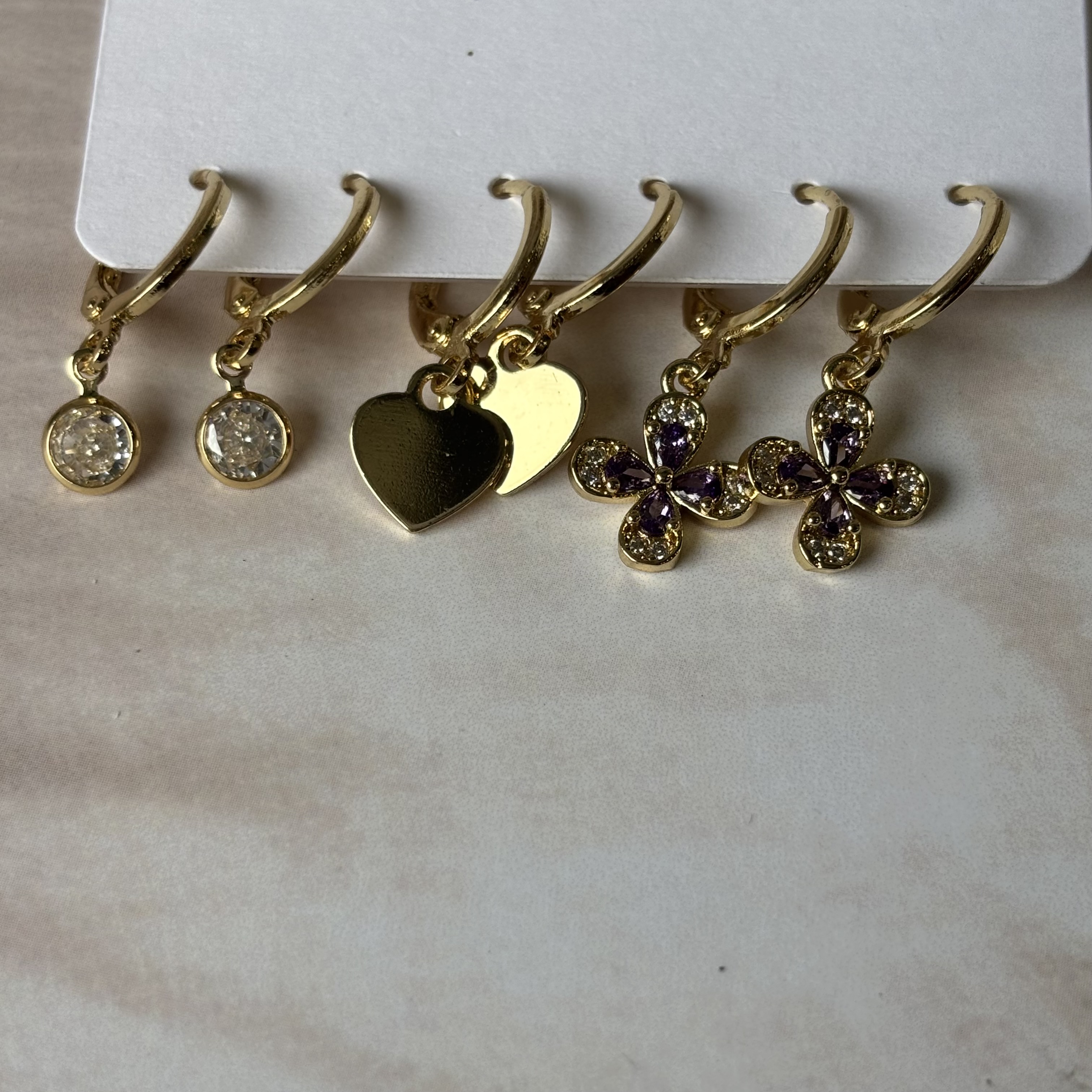 3 pairs of golden earrings- floral