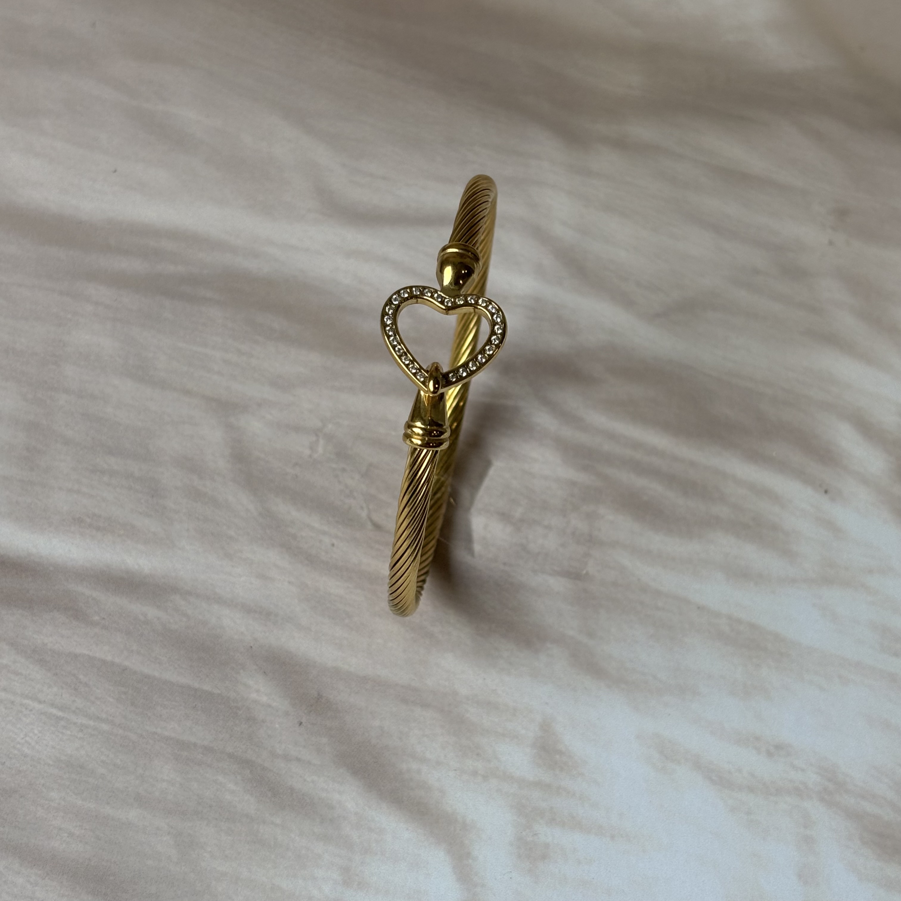 Spiral bangle with heart lock