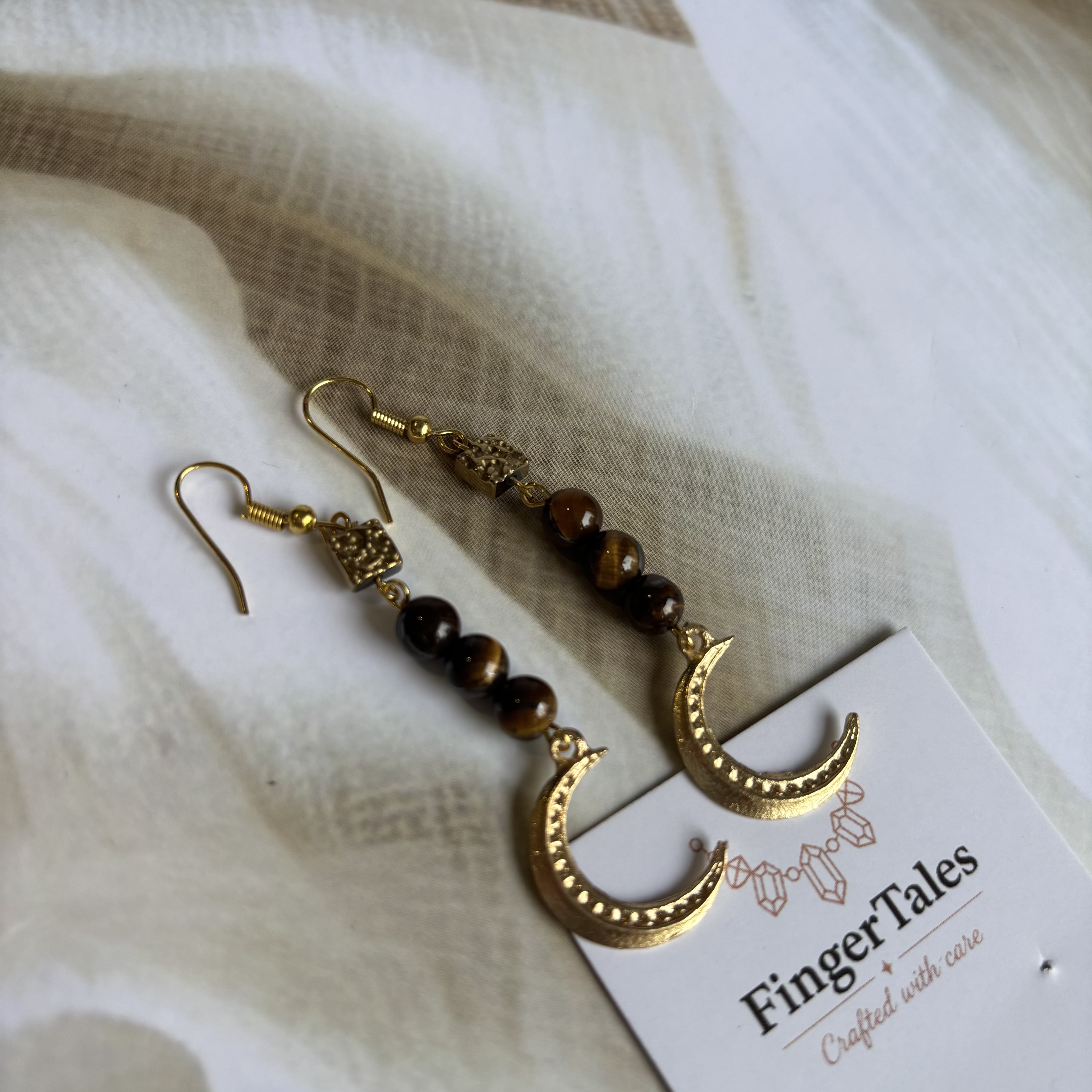 Tiger eye with moon hangings
